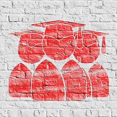 Image showing Red Group of Graduates Icon on White Brick Wall.