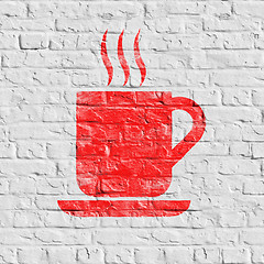 Image showing Red Cup of Coffee Icon on White Brick Wall.