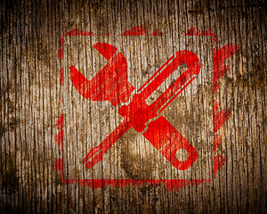 Image showing Red Icon of Crossed Screwdriver on Wood.