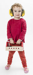 Image showing child in red with toolbox and earmuffs