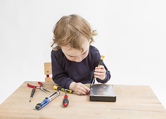 Image showing young child opening hard drive