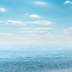 Image showing light clouds on sky over blue sea