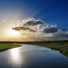 Image showing cloudy sunset over river