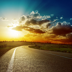 Image showing fantastic sunset over asphalt road