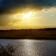 Image showing dramatic yellow sunset over river