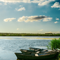 Image showing boats on river on sunset time