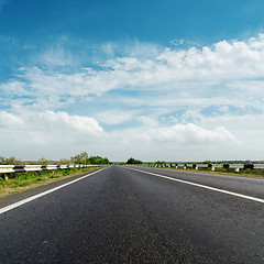 Image showing black asphalt road and cloudy horizon