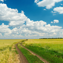 Image showing dirty road to cloudy horizon
