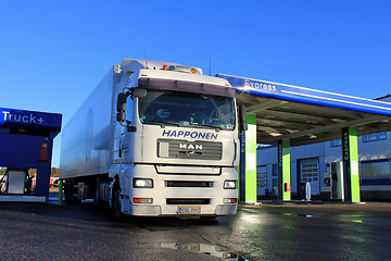 Image showing White Man 18.480 Truck and Trailer at a Filling Station