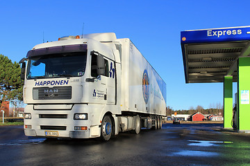 Image showing White Man TGA 18.480 Truck and Trailer at a Filling Station