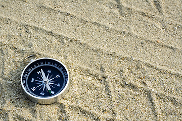 Image showing Compass on sand track

