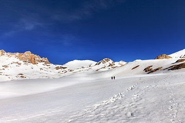 Image showing Two hikers on snow plateau