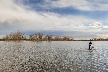 Image showing stand up paddling in fall