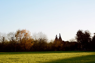 Image showing Two oast houses in rural Kent at sundown