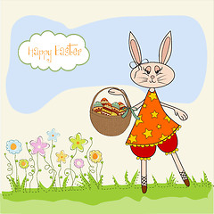 Image showing Easter bunny with a basket of Easter eggs