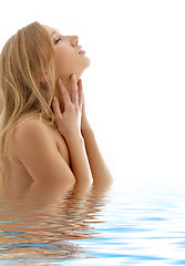 Image showing healthy blond with closed eyes in water