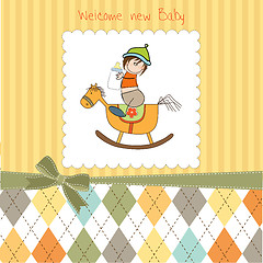 Image showing baby boy shower shower with wood horse toy