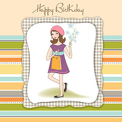 Image showing pretty girl with gift and flowers. birthday card