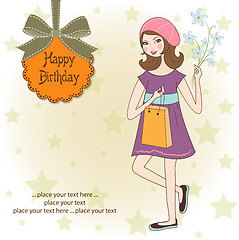 Image showing pretty girl with gift and flowers. birthday card