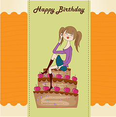 Image showing sexy young woman sitting on a big cake