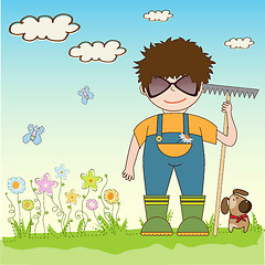 Image showing young gardener who cares for flowers