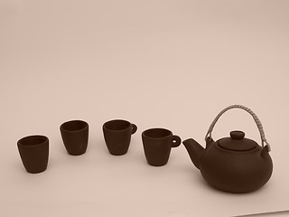 Image showing Oriental teapot with cups