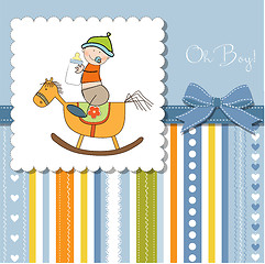 Image showing baby boy shower shower with wood horse toy