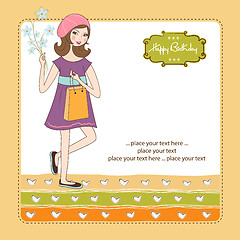 Image showing pretty girl with gift and flowers. birthday card