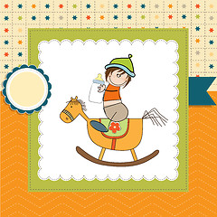 Image showing baby boy shower shower with wood horse toy