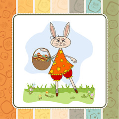 Image showing Easter bunny with a basket of Easter eggs