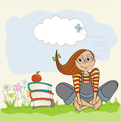 Image showing studious girl sitting barefoot in the grass