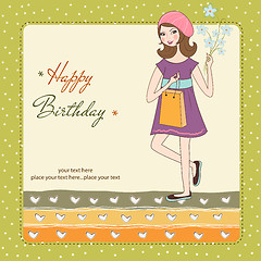 Image showing pretty girl with gift and flowers. birthday card