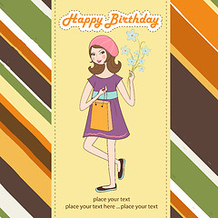 Image showing pretty girl with gift and flowers. birthday card