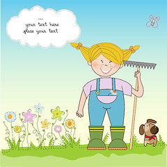 Image showing young gardener who cares for flowers