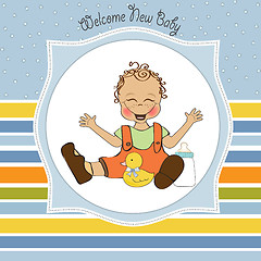 Image showing baby boy playing with his duck toy, welcome baby card