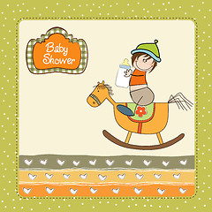 Image showing baby boy shower shower with wood horse toy