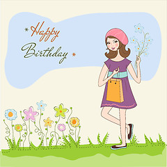 Image showing pretty girl with gift and flowers. birthday card