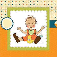 Image showing baby boy playing with his duck toy, welcome baby card