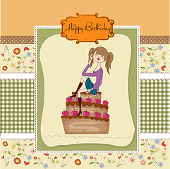 Image showing sexy young woman sitting on a big cake