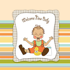 Image showing baby boy playing with his duck toy, welcome baby card