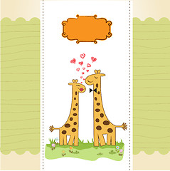 Image showing Funny giraffe couple in love