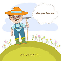 Image showing young gardener who cares for flowers