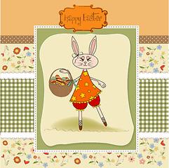 Image showing Easter bunny with a basket of Easter eggs