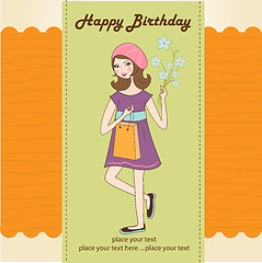 Image showing pretty girl with gift and flowers. birthday card