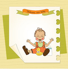 Image showing baby boy playing with his duck toy, welcome baby card