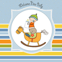 Image showing baby boy shower shower with wood horse toy