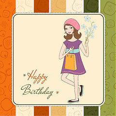 Image showing pretty girl with gift and flowers. birthday card