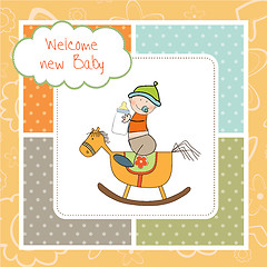 Image showing baby boy shower shower with wood horse toy