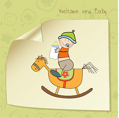 Image showing baby boy shower shower with wood horse toy