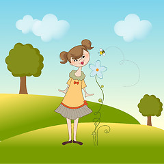 Image showing small young lady who smells a flower